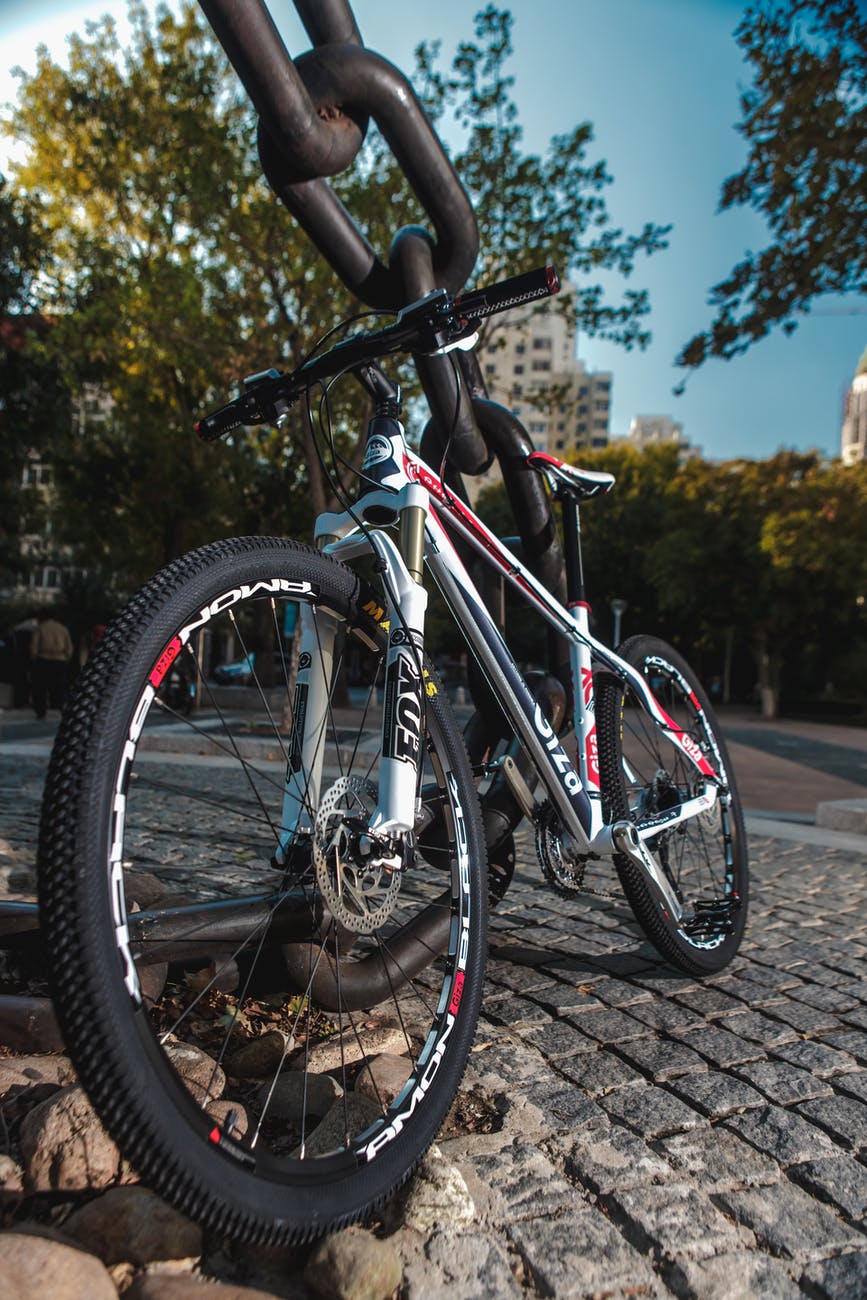 low angled photo of black red and white hardtail bike