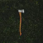 brown and silver axe on grass