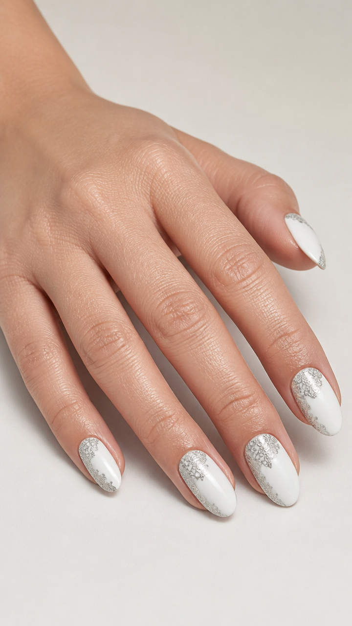 White Oval Nails with Silver Lace Patterns