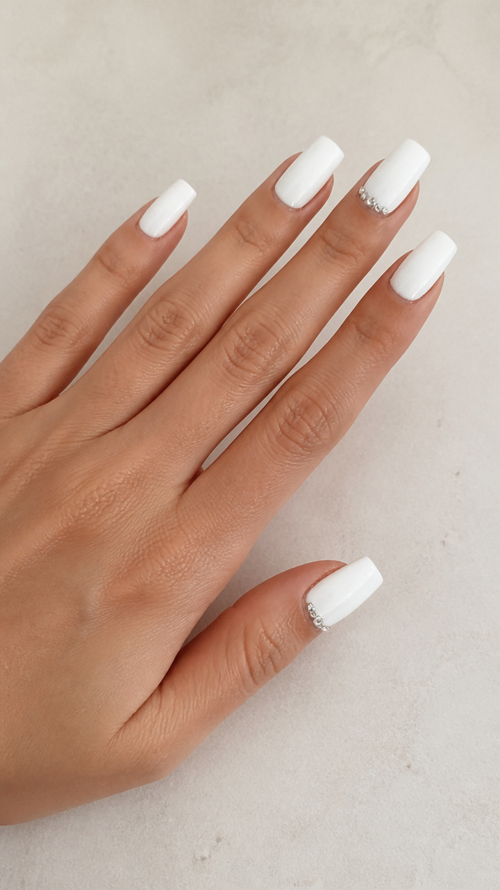 Glossy White Square Nails with Crystal Embellishments