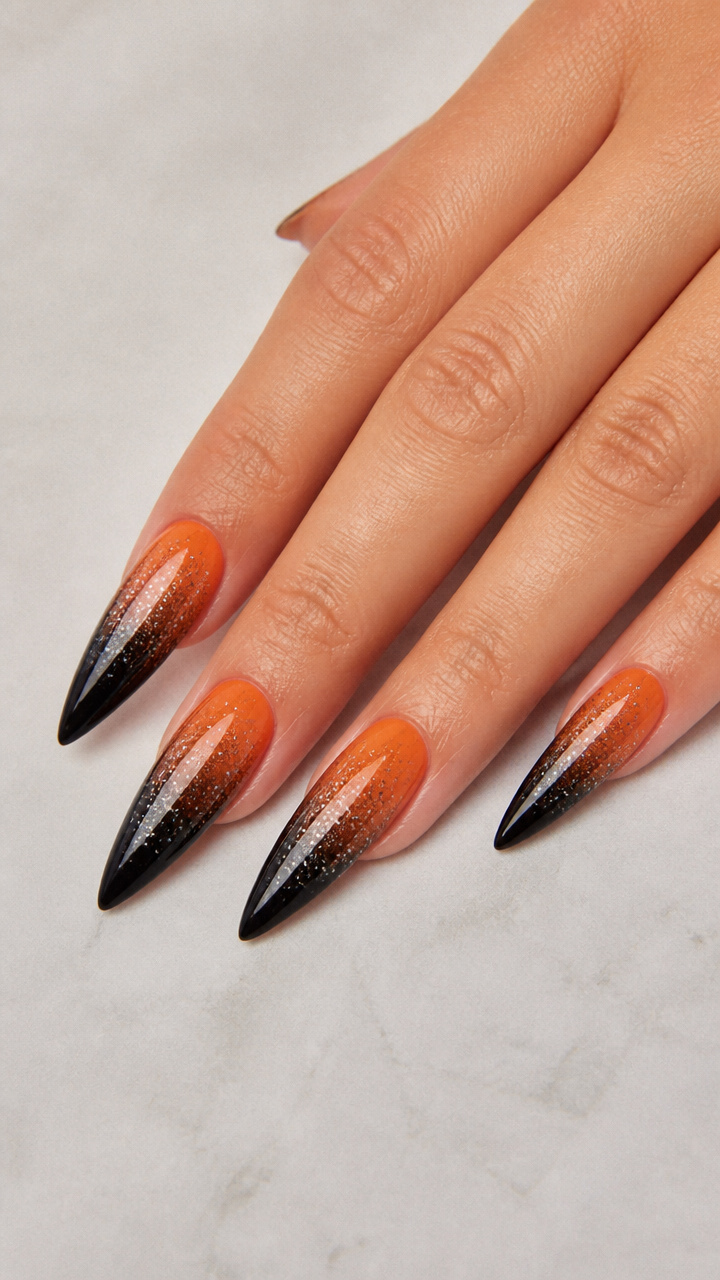 Gradient Orange to Black Stiletto Tips with Silver Glitter Fade