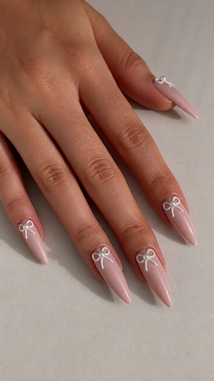 White Bow and Pearl Accent on Stiletto Nails