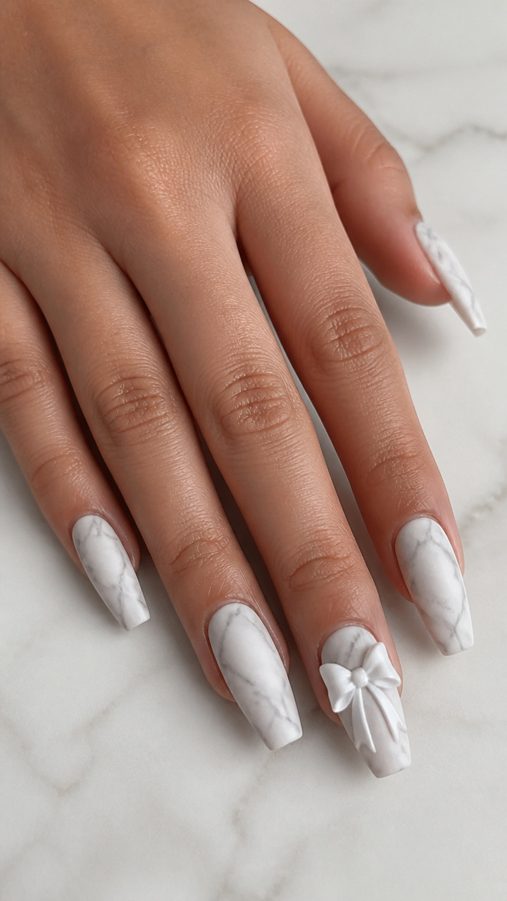 White Bow on a Marble Effect Nail