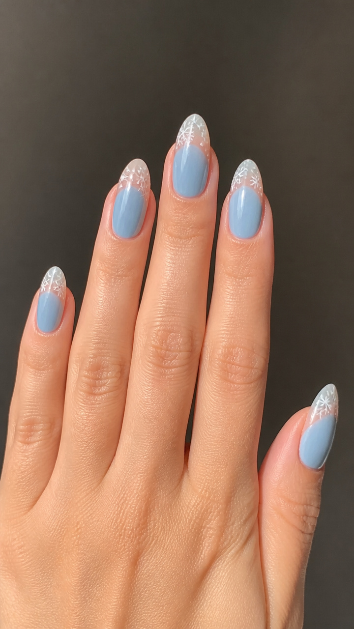Glacier Blue Almond Nails with Negative Space Snowflakes