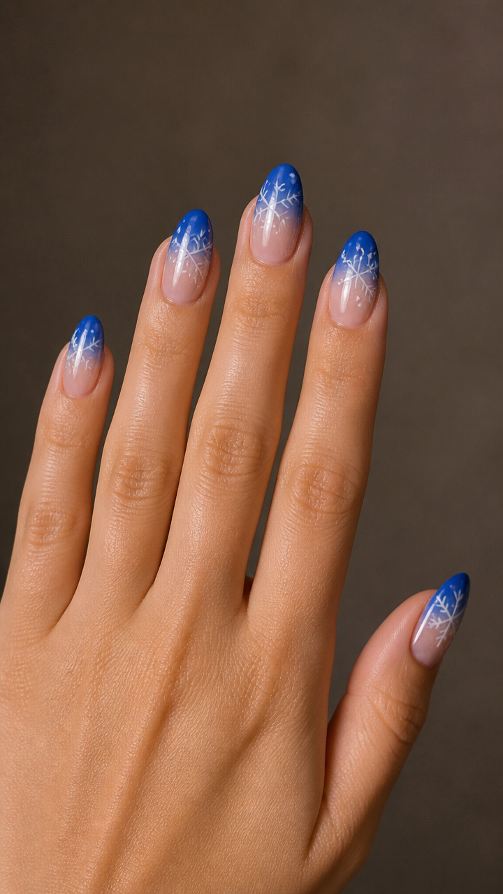 Cobalt Almond Nails with Negative Space Snowflakes