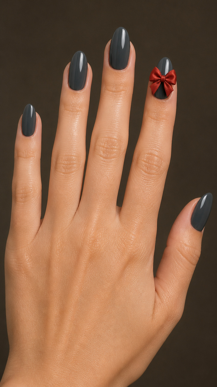 Charcoal Gray Nails with Single Red Bow Accent