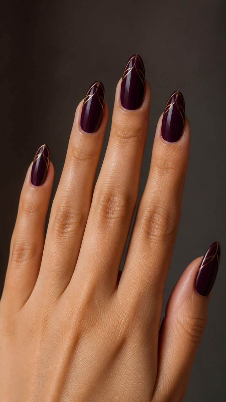 Deep Plum Almond Nails with Minimalist Gold Line Art
